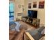 Comfortable living room with television, coastal-themed decor, and a view of the outdoor balcony at 9501 Shore Dr. # 323, Myrtle Beach, SC 29572