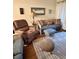 Cozy living room featuring comfortable seating, a decorative rug, and a whale-themed art piece at 9501 Shore Dr. # 323, Myrtle Beach, SC 29572