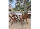 Outdoor patio with four chairs and a table, perfect for relaxing and enjoying the outdoors at 9501 Shore Dr. # 323, Myrtle Beach, SC 29572