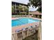 Serene community pool surrounded by lounge chairs and lush landscaping in a desirable complex at 9501 Shore Dr. # 323, Myrtle Beach, SC 29572