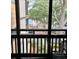 Balcony view showcasing an outdoor seating area, partial pool view and lush foliage from an elevated vantage point at 9501 Shore Dr. # 323, Myrtle Beach, SC 29572