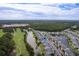 Panoramic aerial view of lakeside townhomes with a golf course nearby; a serene and picturesque neighborhood at 964 Great Egret Circle Sw # B, Sunset Beach, NC 28468