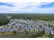 Beautiful aerial view of townhomes near a lake and a lush green golf course in a peaceful community at 964 Great Egret Circle Sw # B, Sunset Beach, NC 28468