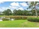 Picturesque waterfront view showing a lush backyard blending into a serene lake, reflecting the beauty of nature at 964 Great Egret Circle Sw # B, Sunset Beach, NC 28468
