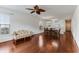 A comfortable living space with hardwood floors connects the dining area and a bright window at 964 Great Egret Circle Sw # B, Sunset Beach, NC 28468