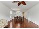 A bright living space shows a dining area with an open layout, hardwood floors, and natural light at 964 Great Egret Circle Sw # B, Sunset Beach, NC 28468