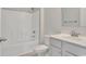 Clean, bright bathroom with a white tub, tile surround, and vanity, offering a fresh and modern look at 1004 Fowler Rd., Conway, SC 29526