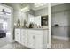 Bathroom featuring double sink vanity, tiled floors and access to closet at 1004 Fowler Rd., Conway, SC 29526