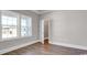 Bedroom with wood floors, neutral paint, base trim and an open closet at 1004 Fowler Rd., Conway, SC 29526