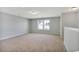 Spacious bonus room with neutral carpet and ample natural light from the window, perfect for versatile living at 1004 Fowler Rd., Conway, SC 29526