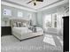 Bright main bedroom features a ceiling fan, sitting area, and an ensuite bathroom at 1004 Fowler Rd., Conway, SC 29526