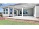 Covered patio features gray siding, white trim, and a brick foundation, perfect for outdoor enjoyment and relaxation at 1004 Fowler Rd., Conway, SC 29526