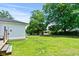 Spacious backyard with lush green grass and mature trees, great for outdoor activities at 1008 N Withlacoochee Ave., Marion, SC 29571
