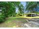 Expansive driveway leading to a charming home with a covered parking area at 1008 N Withlacoochee Ave., Marion, SC 29571