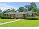 Charming brick home with a well-maintained lawn and inviting front porch at 1008 N Withlacoochee Ave., Marion, SC 29571