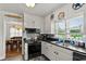 Bright kitchen with black countertops, white cabinets and decorative stars on the walls at 1008 N Withlacoochee Ave., Marion, SC 29571