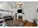Spacious living room with a fireplace, ceiling fans, hardwood floors, and ample natural light for comfortable living at 1008 N Withlacoochee Ave., Marion, SC 29571