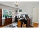 Office with natural light, hardwood floors, classic chandelier, and ample desk space for productivity at 1008 N Withlacoochee Ave., Marion, SC 29571