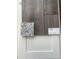 Interior design finishes featuring Shaw luxury vinyl plank flooring, white cabinets, and granite countertop at 1010 Black Locust Pl., Longs, SC 29568