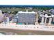 Aerial view of the resort on the beach with pools, lounge chairs, and stunning ocean views at 1012 N Waccamaw Dr. # 305, Garden City Beach, SC 29576
