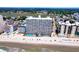 Aerial view of oceanfront high-rise condo with beach access and outdoor pool at 1012 N Waccamaw Dr. # 305, Garden City Beach, SC 29576