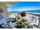 Outdoor dining area with a view of the beach at 1012 N Waccamaw Dr. # 305, Garden City Beach, SC 29576