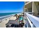 Beautiful beach view from condo balcony with palm trees, swimming pool, and the ocean at 1012 N Waccamaw Dr. # 305, Garden City Beach, SC 29576