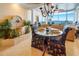 Open floor plan with decorative fountain, dining area, and ocean view in this elegant home at 1012 N Waccamaw Dr. # 305, Garden City Beach, SC 29576