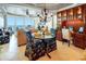 Cozy dining area with ocean views, featuring a glass table and custom upholstered chairs near built-in shelving at 1012 N Waccamaw Dr. # 305, Garden City Beach, SC 29576