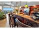 Kitchen featuring a bar area with ocean views and wood cabinets at 1012 N Waccamaw Dr. # 305, Garden City Beach, SC 29576