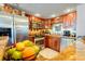 Well-lit kitchen featuring stainless steel appliances, granite countertops, and ample cabinet space at 1012 N Waccamaw Dr. # 305, Garden City Beach, SC 29576