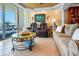 Inviting living space with plush recliners, sofa, and balcony access at 1012 N Waccamaw Dr. # 305, Garden City Beach, SC 29576