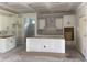Bright, unfinished kitchen featuring white cabinets, a center island and an open layout for seamless entertaining at 1014 Black Locust Pl., Longs, SC 29568