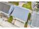 Aerial view of a gray roofed beach house with covered parking at 121 Easy St., Garden City Beach, SC 29576