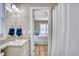 Well-lit bathroom featuring a vanity with granite countertop, providing a clean and functional space at 121 Easy St., Garden City Beach, SC 29576