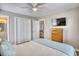 Bedroom with a ceiling fan and a wooden dresser, providing comfortable living space at 121 Easy St., Garden City Beach, SC 29576