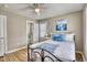 Relaxing bedroom with nautical decor, a comfortable bed, and an ensuite bathroom for added convenience at 121 Easy St., Garden City Beach, SC 29576