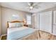Comfortable bedroom featuring wood flooring, a ceiling fan and natural light at 121 Easy St., Garden City Beach, SC 29576