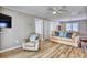 Inviting living room with wood flooring, comfortable seating, and a relaxed ambiance at 121 Easy St., Garden City Beach, SC 29576