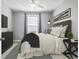 Comfortable bedroom with large window, ceiling fan, and contemporary decor and finishes at 124 Castaway Key Dr., Pawleys Island, SC 29585