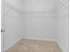 Walk-in closet featuring neutral carpet and wire shelving for optimal storage solutions at 124 Castaway Key Dr., Pawleys Island, SC 29585