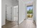 Bright foyer featuring tile floors and an open view into a bedroom, creating a welcoming entrance at 124 Castaway Key Dr., Pawleys Island, SC 29585