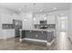 Open kitchen featuring stainless steel appliances, and large kitchen island with a sink at 124 Castaway Key Dr., Pawleys Island, SC 29585