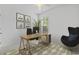 Bright home office area with natural light, desk, plants, and contemporary decor at 124 Castaway Key Dr., Pawleys Island, SC 29585