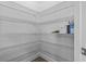 Walk-in pantry with wire shelving units for ample storage space and organization at 124 Castaway Key Dr., Pawleys Island, SC 29585