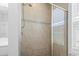 Tiled walk-in shower featuring a rain shower head and neutral tile at 124 Castaway Key Dr., Pawleys Island, SC 29585