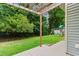 View of backyard with patio, playground equipment, and perimeter fencing at 124 Shady Arbor Loop, Longs, SC 29568