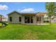 View of backyard featuring pergola, playground, grassy area, and house exterior at 124 Shady Arbor Loop, Longs, SC 29568