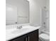 Bathroom with a tub and shower, vanity with dark cabinets and a white countertop and sink at 124 Shady Arbor Loop, Longs, SC 29568