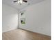 Bright bedroom with a ceiling fan and large window to backyard, wood-look flooring at 124 Shady Arbor Loop, Longs, SC 29568